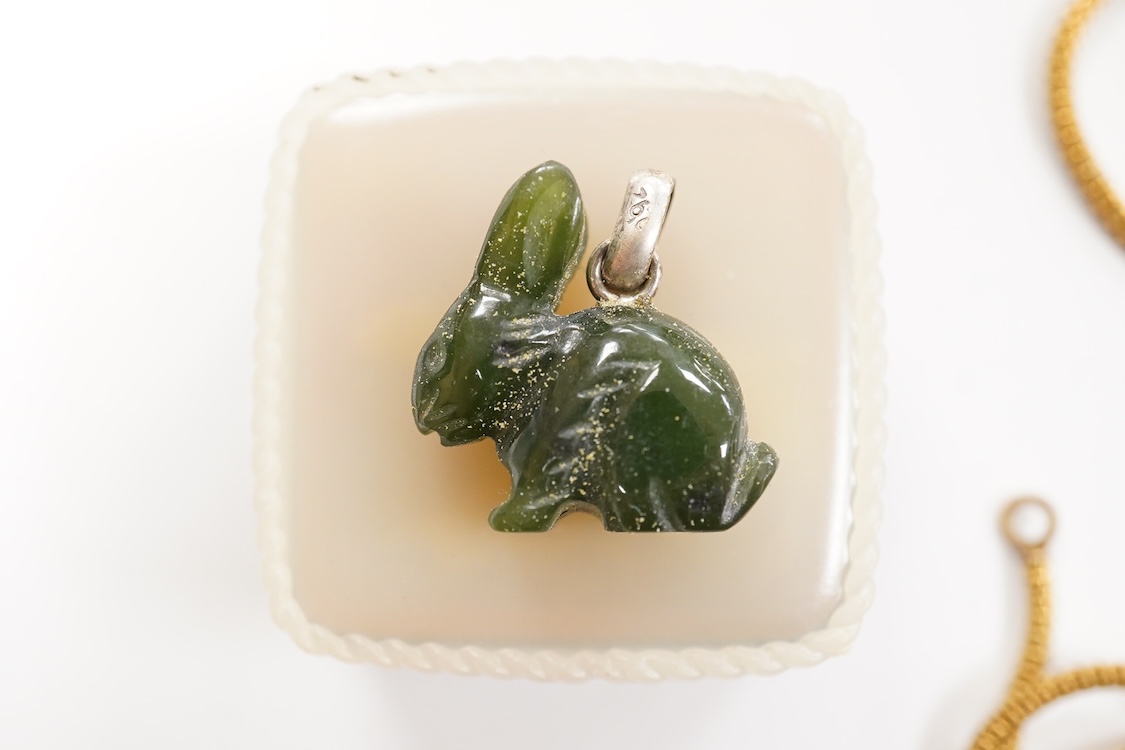 A collection of assorted jewellery including a stylish textured 925 necklace, 76cm and a similar bracelet, 18cm, a Portuguese white metal hinged bracelet, a white metal necklace with amberoid pendant, a white metal and g